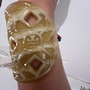 Tory Burch cuff bracelet ; plastic, used; good condition